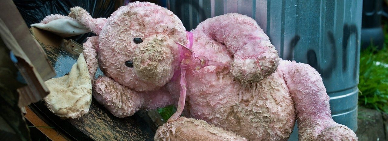 Child's pink bunny in debris after a flood